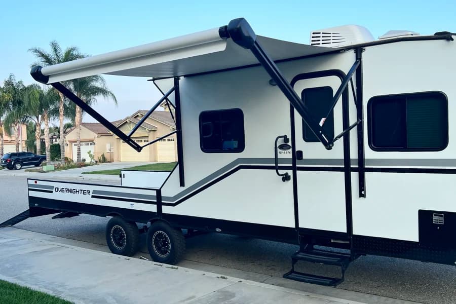 Brand NEW! 2023 Genesis Supreme Overnighter Open Cargo Toy Hauler Fifth-Wheel RV rental in Palm Springs California — exterior